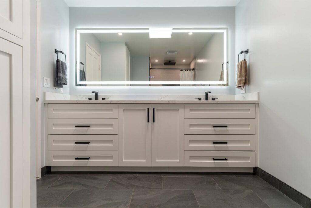 Bathroom remodel price San Francisco project featuring white double vanity with marble countertop and traditional styling by ASL Remodeling