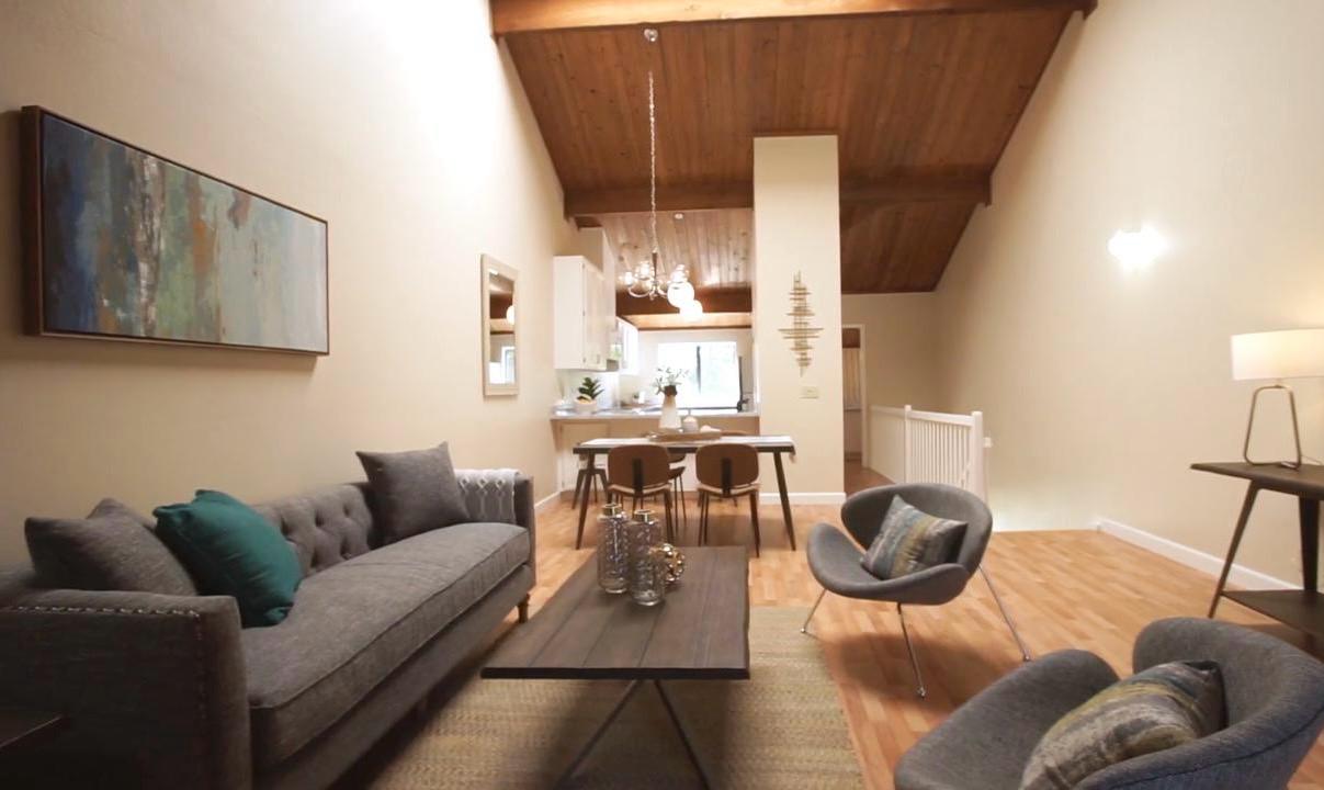 Before home remodel on Central Ave in Mountain View showing living room and dining area with wood ceiling prior to open concept transformation