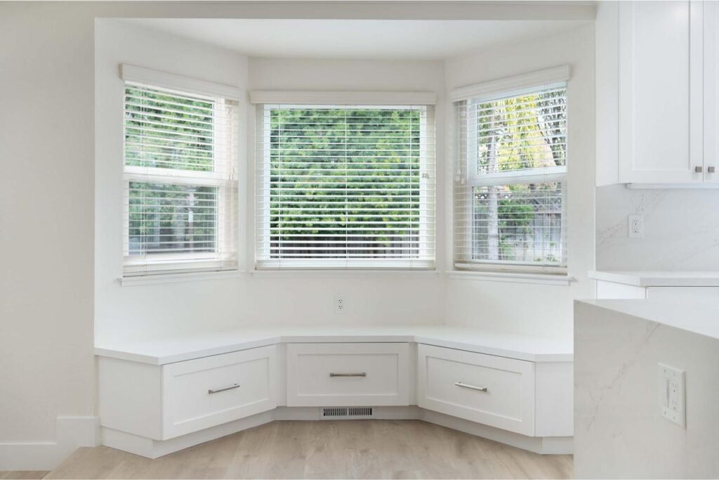 Crossmont Circle kitchen in San Jose with built-in breakfast nook, under-seat deep drawers, bay window seating, and custom cabinetry storage