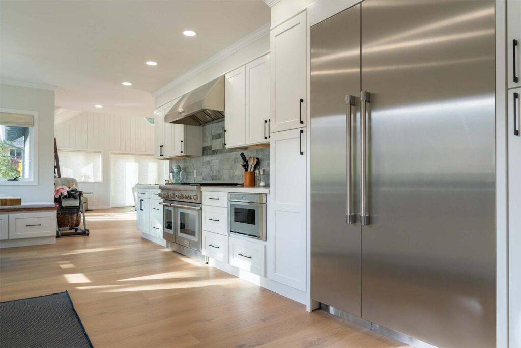 Los Gatos kitchen remodel on Vista Del Mar featuring custom cabinetry, open layout, engineered white oak hardwood flooring, and modern appliances