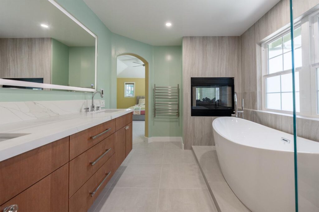 Bathroom remodeling Los Gatos project featuring floating vanity, freestanding tub, and spa-like design with fireplace