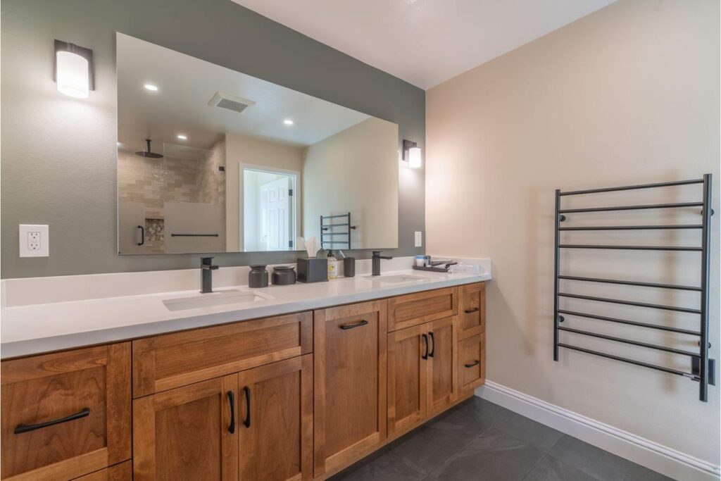 Kitchen and bathroom renovations San Francisco featuring wood vanity with white countertop and modern fixtures by ASL Remodeling