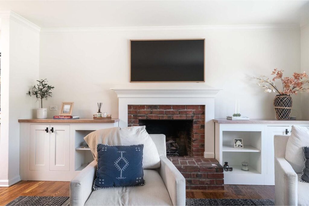 Layout redesign transforms Los Gatos living room with shaker cabinets built-ins and fireplace surround