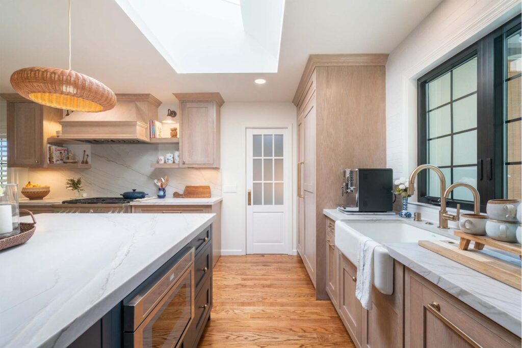 Shulman Ave kitchen remodel in San Jose featuring two-tone maple cabinetry, natural quartzite countertops, and custom walk-in pantry with skylight