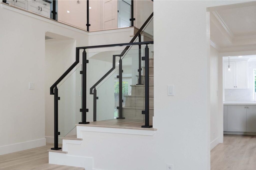 Crossmont Circle home remodel in San Jose with modern staircase featuring matte black railing, tempered glass panels, and white oak hardwood treads