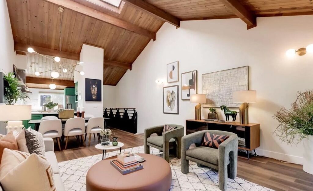 Central Ave home remodel in Mountain View showing open concept living and dining area with wood ceiling, exposed beams, and wide-plank flooring