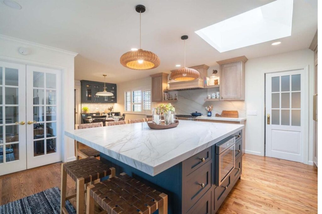 Shulman Ave kitchen remodel in San Jose with two-tone island, natural quartzite countertops, custom maple cabinetry, and open concept layout