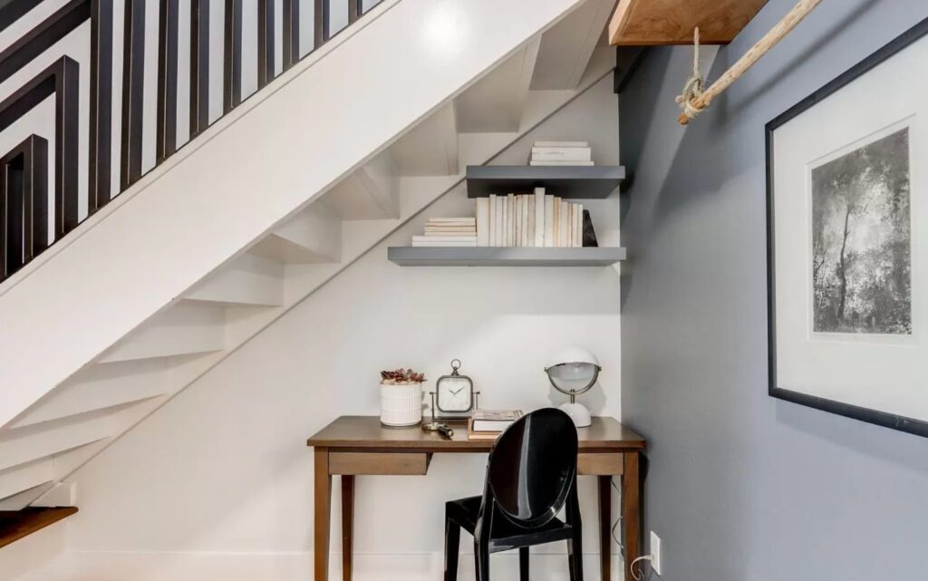 Mountain View home on Central Ave with under-stair workspace, floating shelves, modern stair railing, and efficient use of space