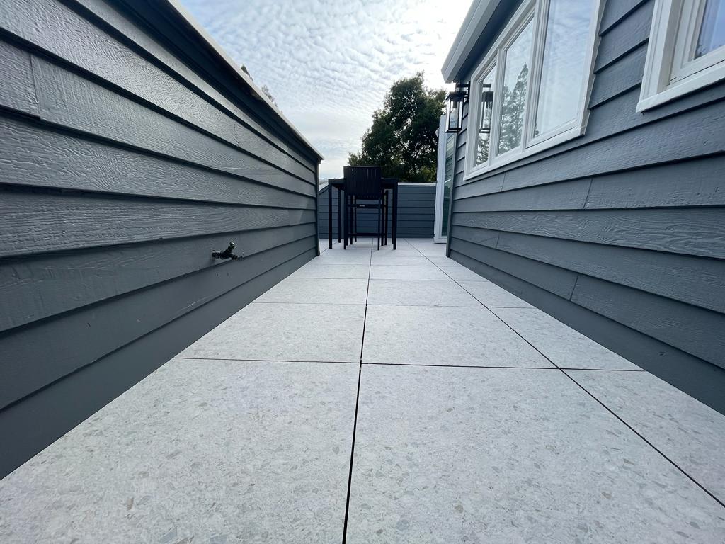 Vista Del Mar home remodel showcasing completed balcony with floating tile system and contemporary exterior finishes by ASL Remodeling in Los Gatos