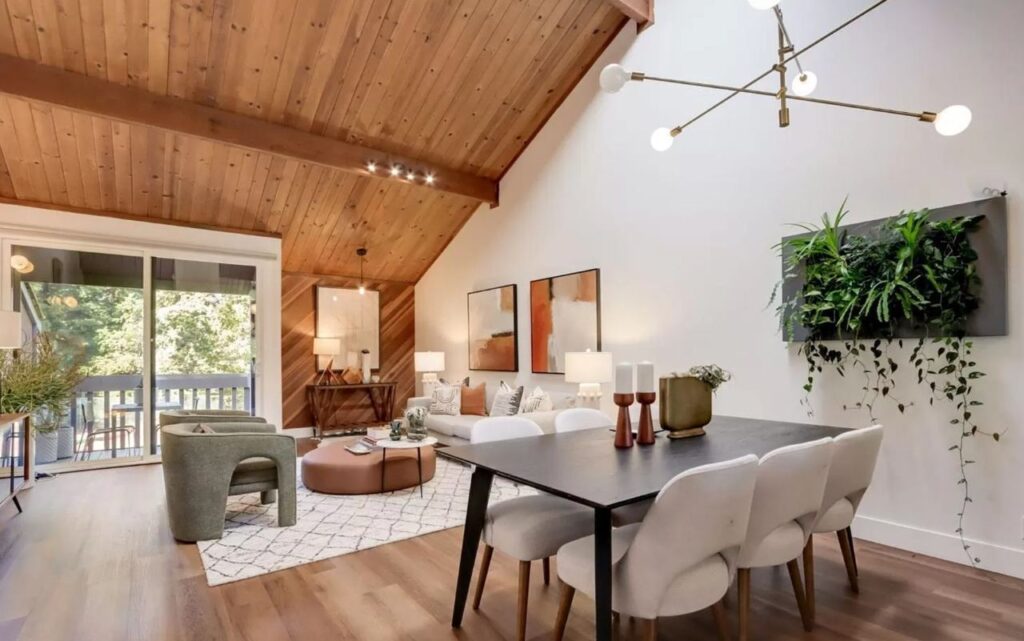 Mountain View home on Central Ave featuring open living area with wood ceiling, diagonal wood accent wall, and wide-plank floating vinyl flooring