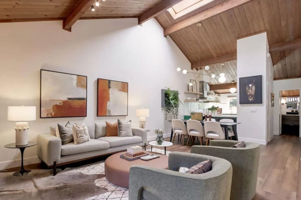 Central Ave home remodel in Mountain View with open concept living area, wood ceiling with skylight, exposed beams, and wide-plank floating vinyl flooring