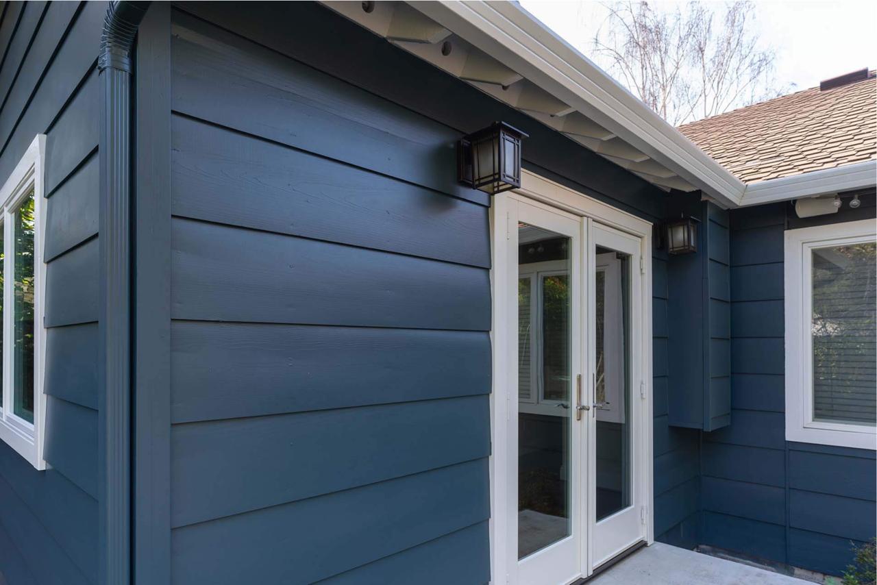 Competitive home addition prices in San Jose for beautiful modern exterior featuring navy siding and contemporary architectural details